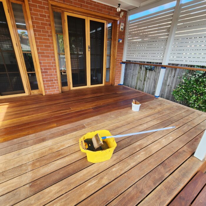 Deck restoration by Sydney painters Mertico: oiled boards beside sanded boards